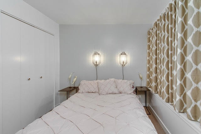 1007 East 61st Street Chicago, IL 60637 - Photo 15 of 20 a bedroom with a bed and a lamp on the dresser