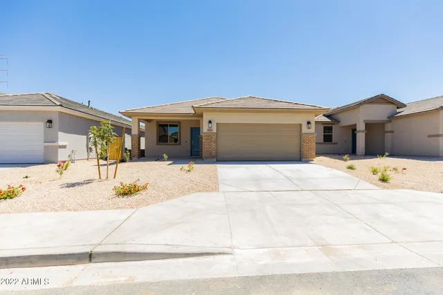 a front view of a house with a outdoor space