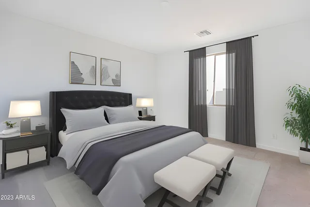 a bedroom with a bed and a window