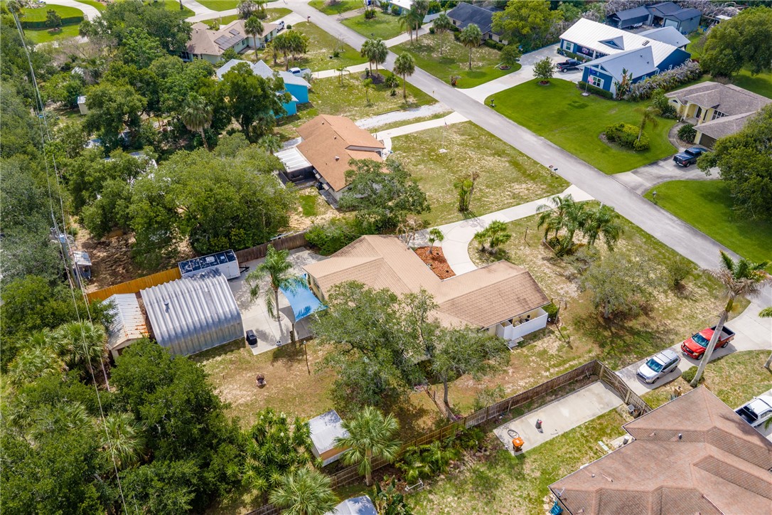 7666 134th Street Sebastian, FL 32958 - Photo 34 of 35 an aerial view of a house with a garden and swimming pool
