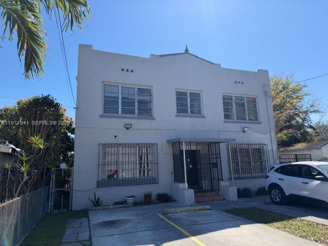 2368 Northwest 3rd Street, Unit 4 Miami, FL 33125 - Photo 20 of 20 a front view of a house with a yard