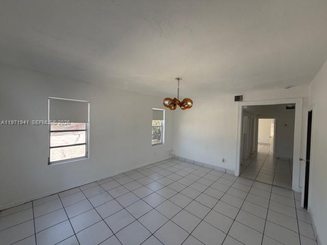 2368 Northwest 3rd Street, Unit 4 Miami, FL 33125 - Photo 2 of 20 an empty room with windows