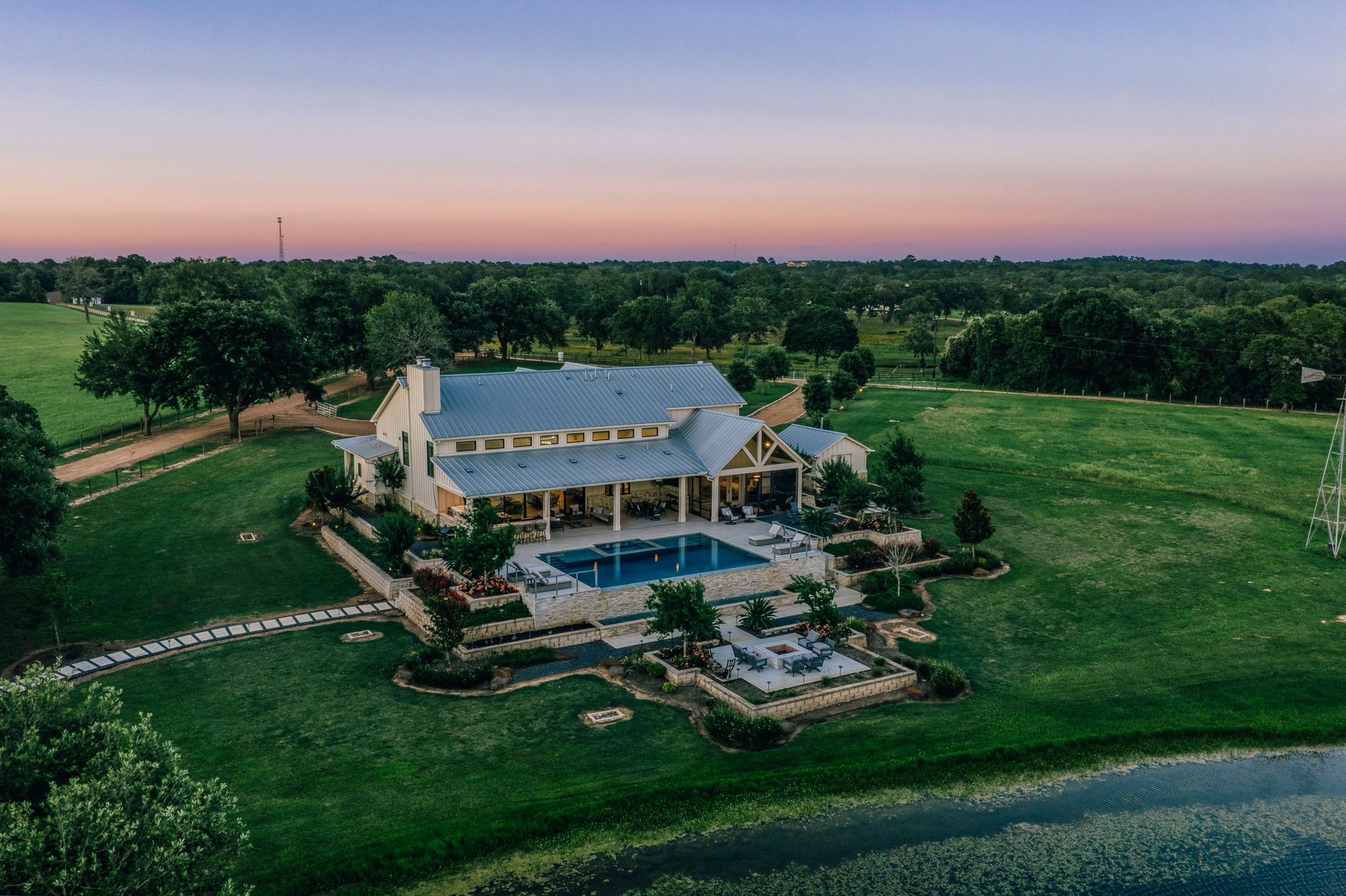 1034 Hilbun Road New Ulm, TX 78950 - Photo 49 of 49 An exceptional legacy property showcasing panoramic views, magnificent oak canopies, sparkling lakes, luxury residences, hunting opportunities, a private shooting range, and unforgettable Texas sunsets.
