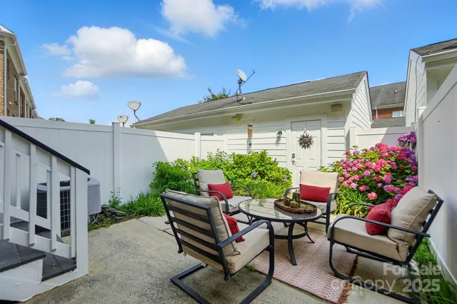 a view of a patio with furniture