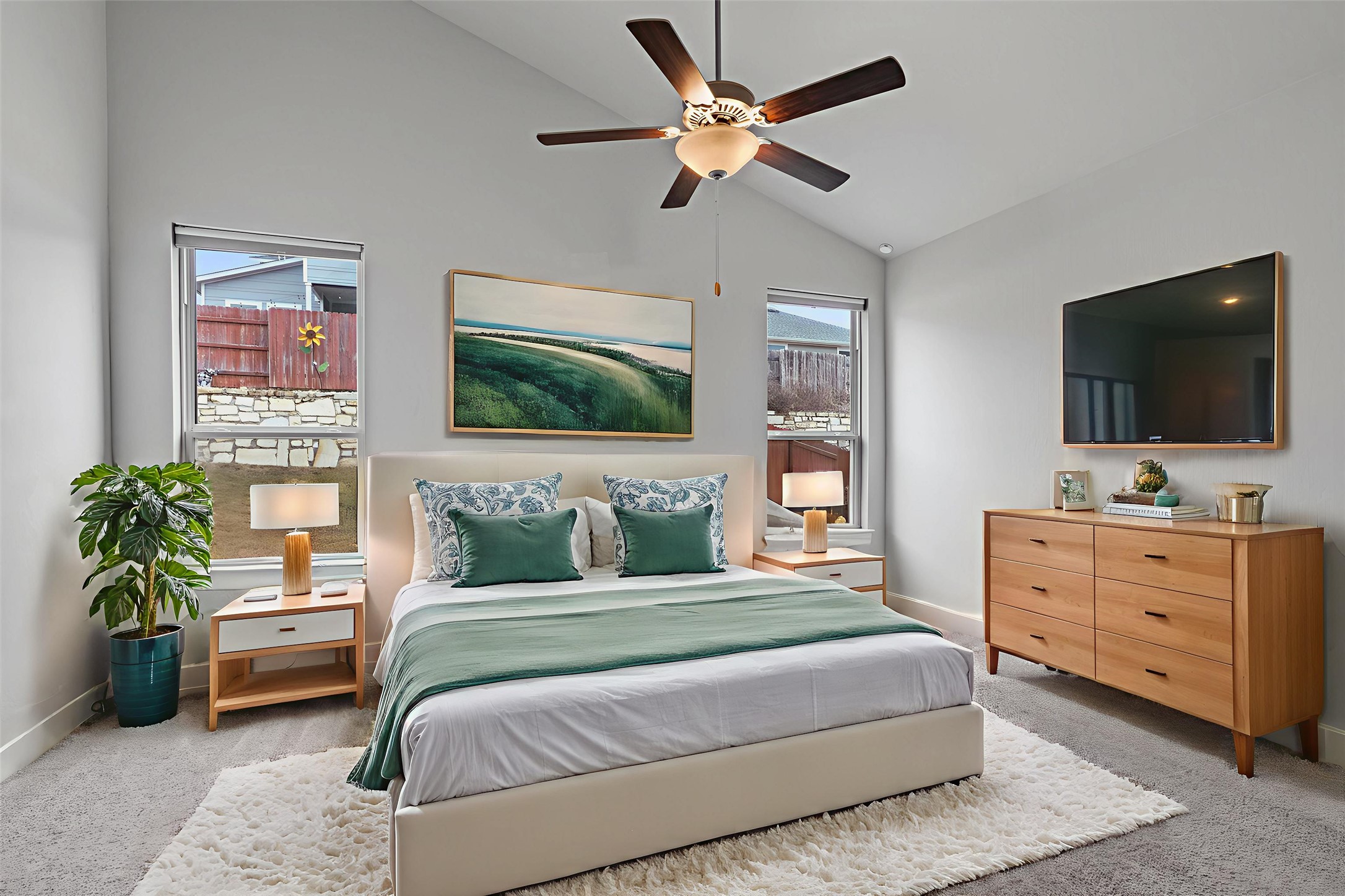 11217 Charger Way Manor, TX 78653 - Photo 13 of 35 Bedroom featuring carpet flooring, lofted ceiling, multiple windows, and ceiling fan