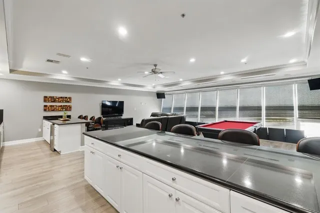 a open kitchen with stainless steel appliances a sink and cabinets