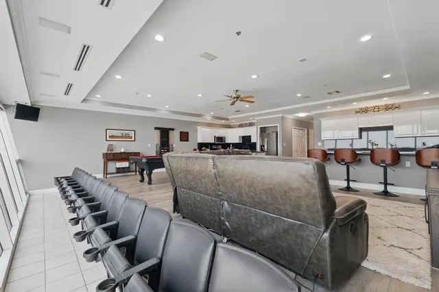 a living room with furniture a table and chairs