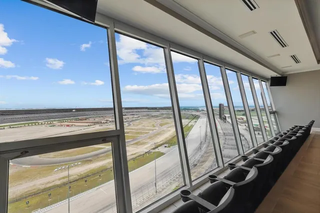 a view of an empty room with windows