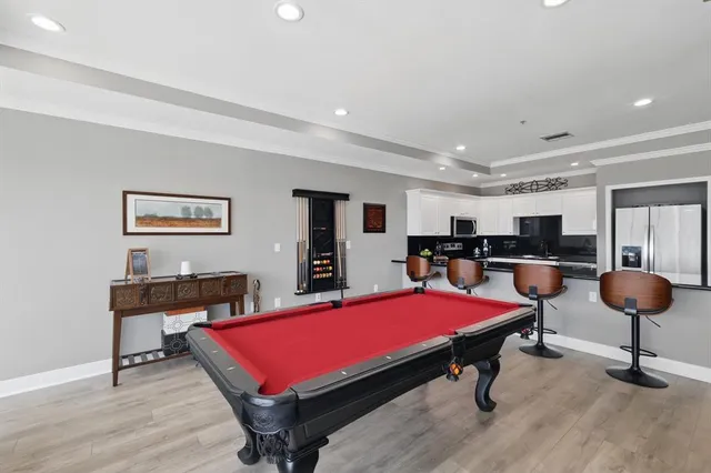 a room with furniture and pool table