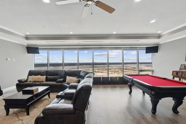 a livingroom with furniture and floor to ceiling window