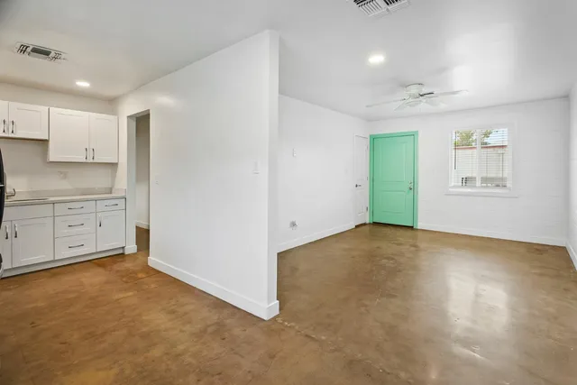 a view of an empty room with a window