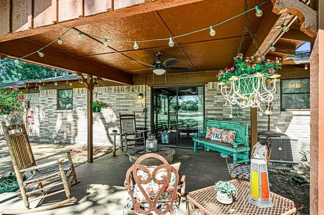 a outdoor living space with furniture and a potted plant
