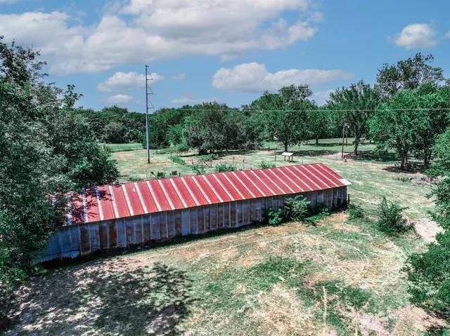 a view of swimming pool with sitting area and garden