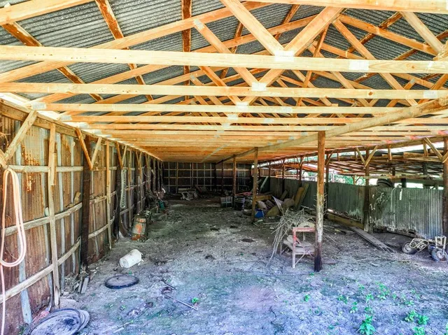 a view of porch with wooden stairs