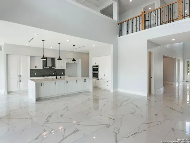 a large white building with kitchen view