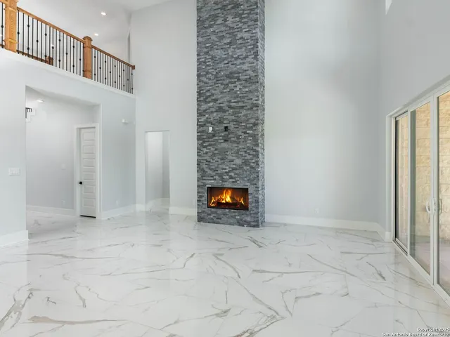 a view of an empty room and entryway