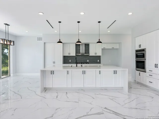 a large kitchen with cabinets