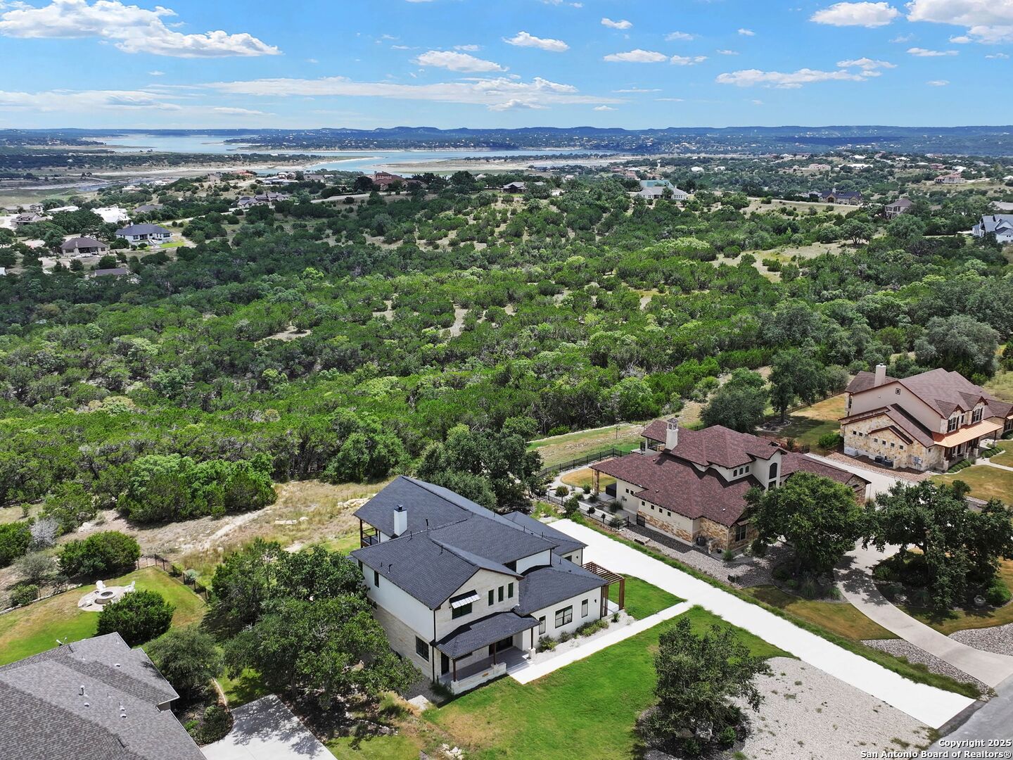 1054 Star Ridge Spring Branch, TX 78070 - Photo 2 of 42 an aerial view of residential houses with outdoor space and ocean view