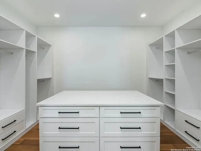 a view of an empty walk in closet