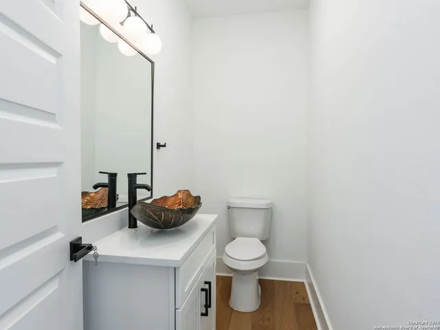 a bathroom with a toilet and a sink