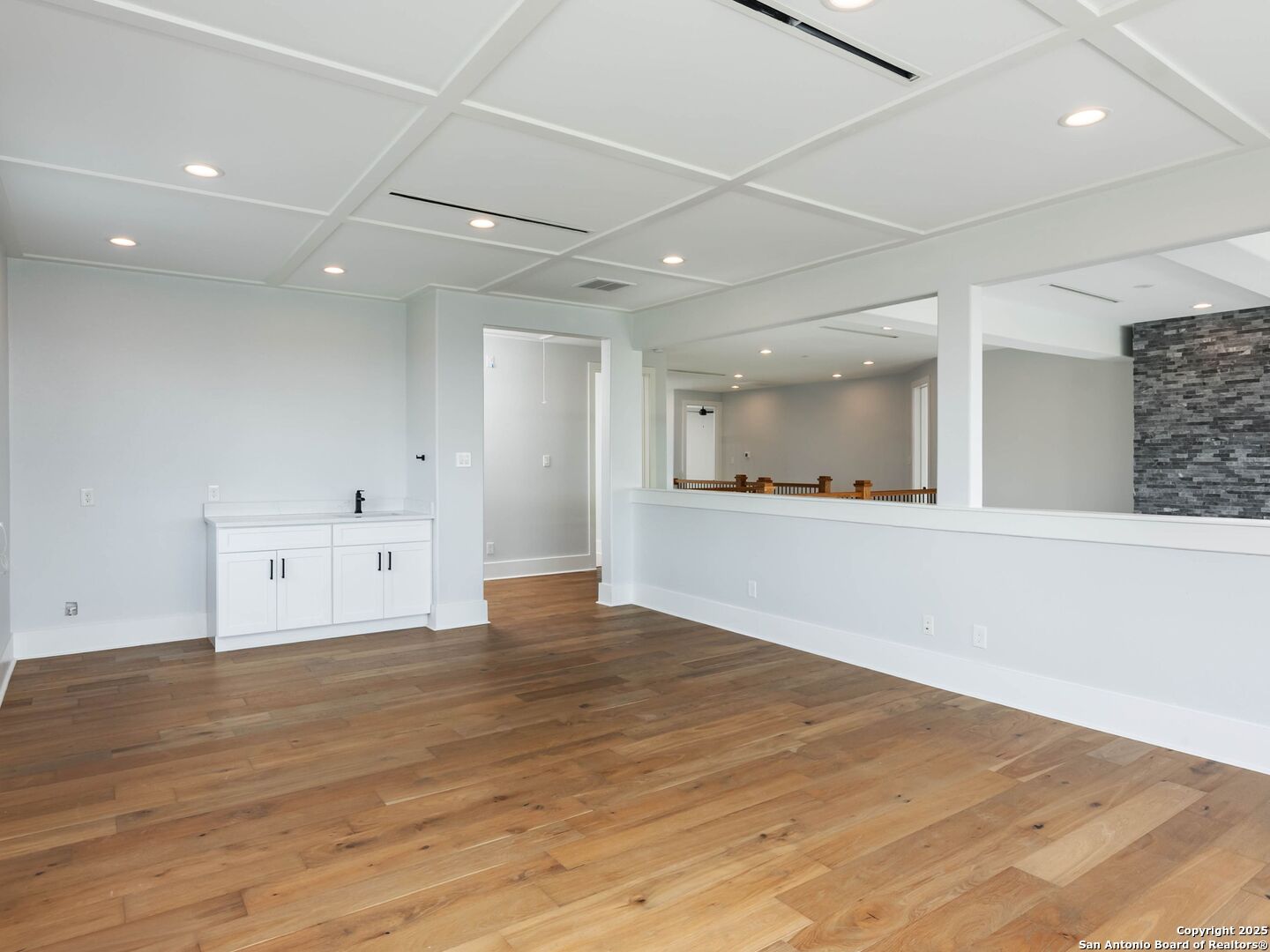 1054 Star Ridge Spring Branch, TX 78070 - Photo 31 of 42 an empty room with wooden floor and windows