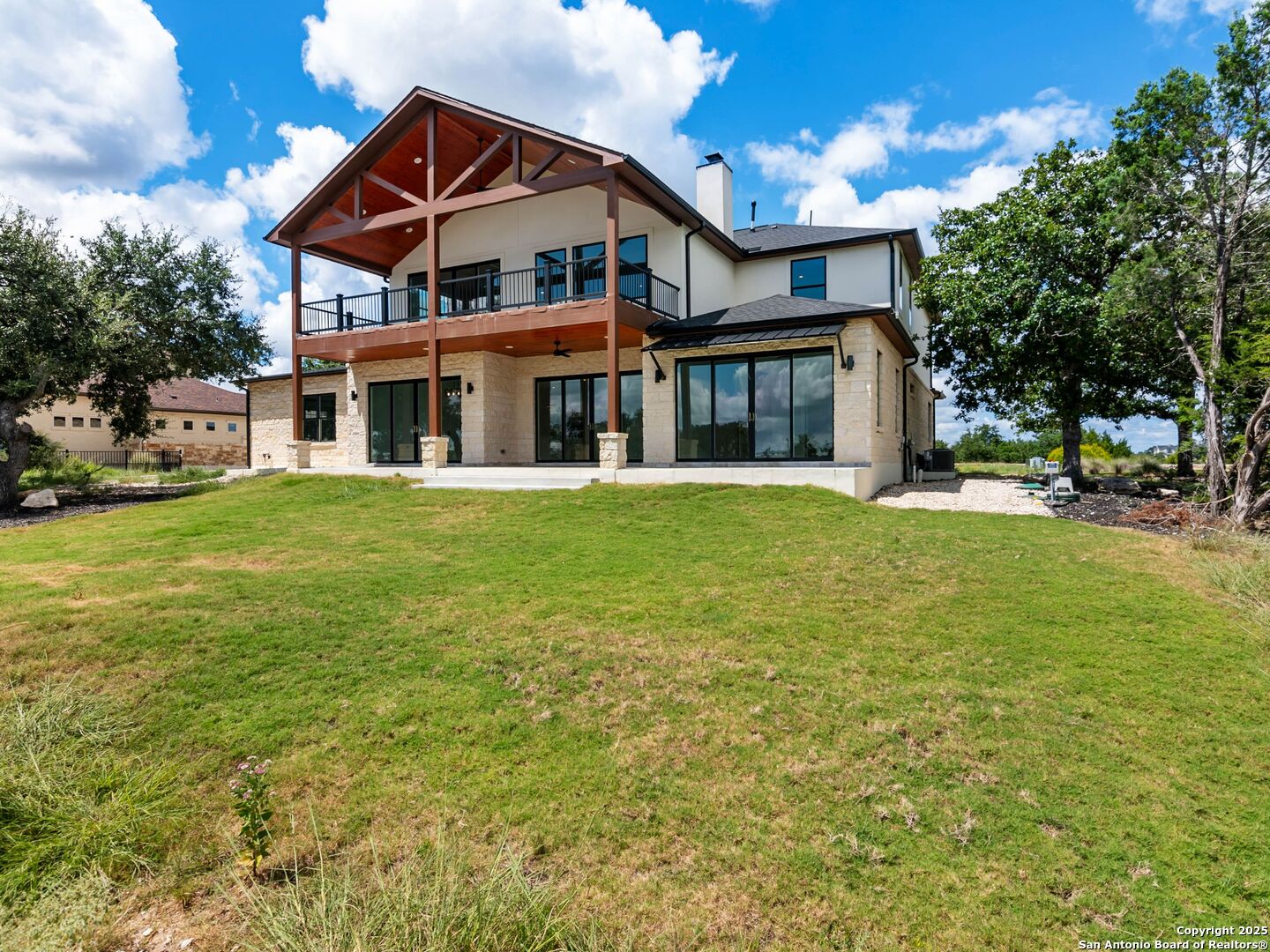 1054 Star Ridge Spring Branch, TX 78070 - Photo 40 of 42 a front view of a house with a yard