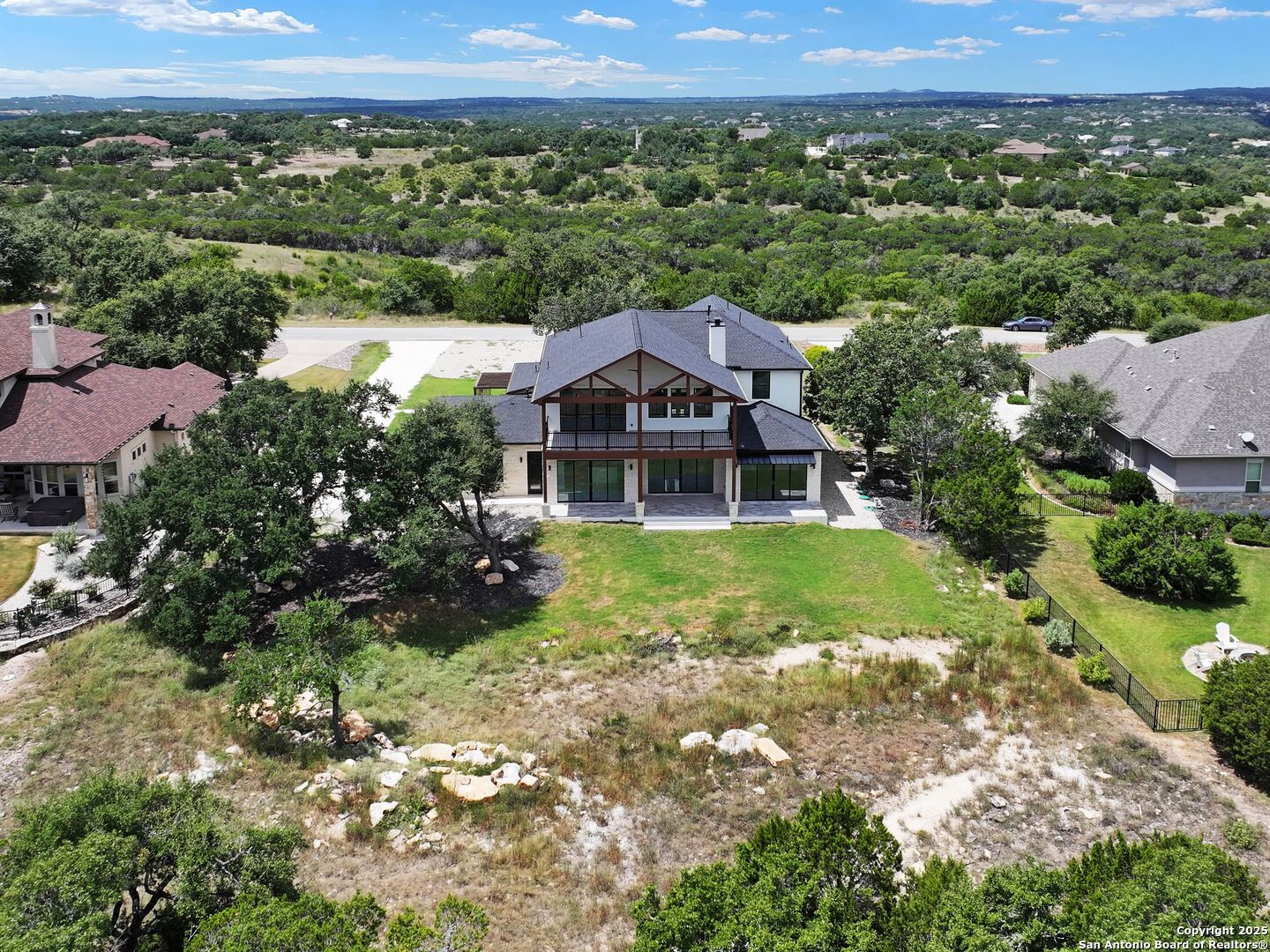 1054 Star Ridge Spring Branch, TX 78070 - Photo 41 of 42 an aerial view of a house with a yard