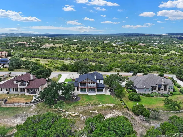 an aerial view of a house with a garden