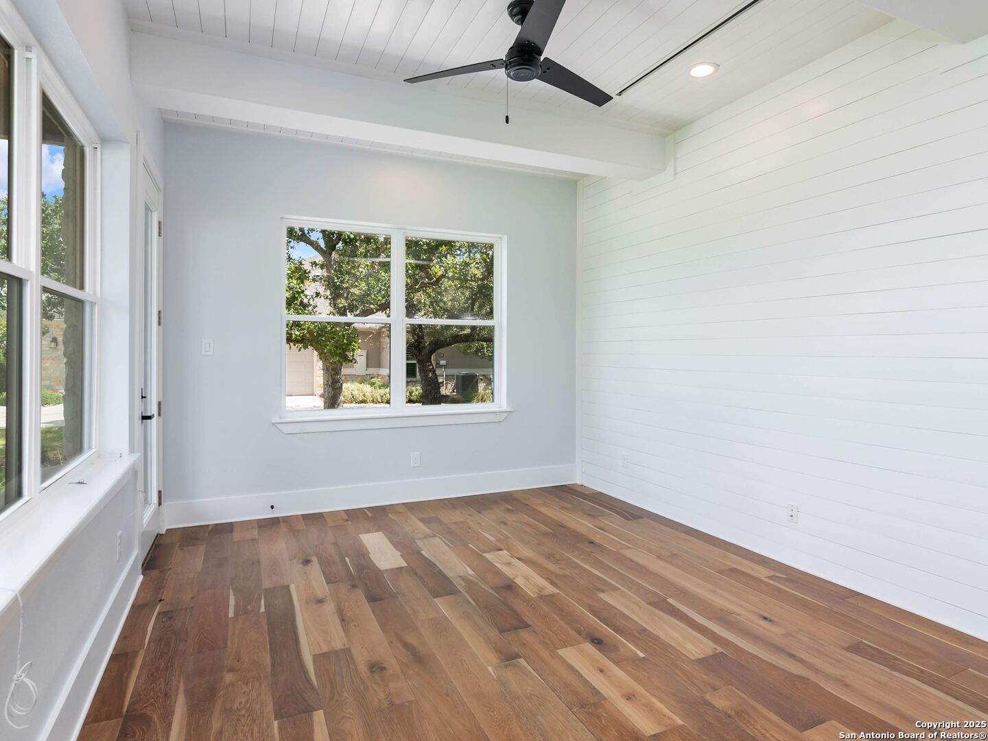 1054 Star Ridge Spring Branch, TX 78070 - Photo 9 of 42 wooden floor in an empty room with a window