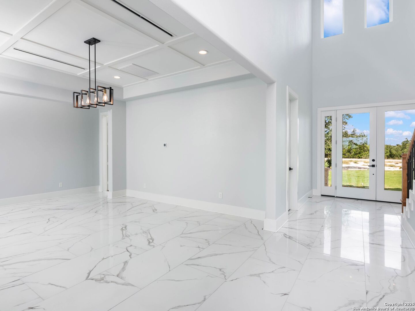 1054 Star Ridge Spring Branch, TX 78070 - Photo 10 of 42 a view of a room with window and chandelier