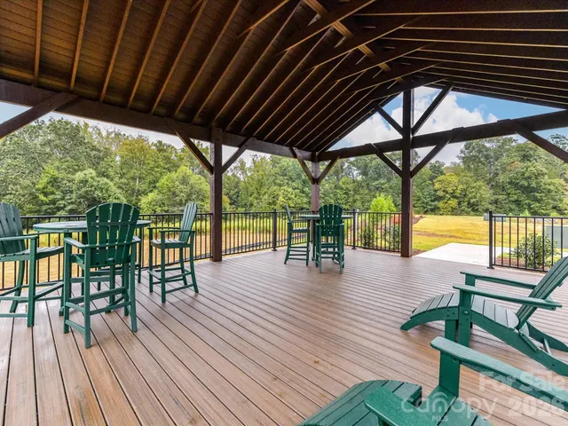 a view of porch with furniture and wooden floor