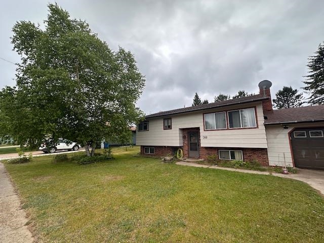 38 Locust Drive Babbitt, MN 55706 - Photo 29 of 29 Bi-level home featuring a front lawn and a garage