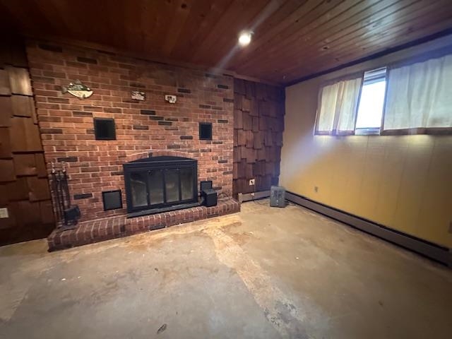 38 Locust Drive Babbitt, MN 55706 - Photo 6 of 29 Unfurnished living room featuring unfinished concrete flooring, wood ceiling, a brick fireplace, and a baseboard radiator
