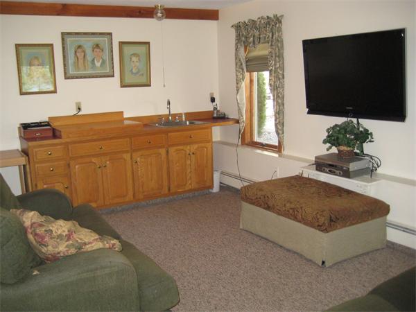 55 Boxford Road Ipswich, MA 01938 - Photo 12 of 21 a living room with furniture and a flat screen tv