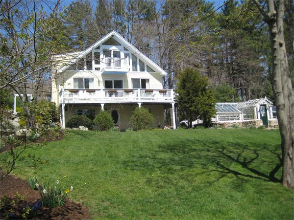 55 Boxford Road Ipswich, MA 01938 - Photo 2 of 21 a front view of a house with a yard