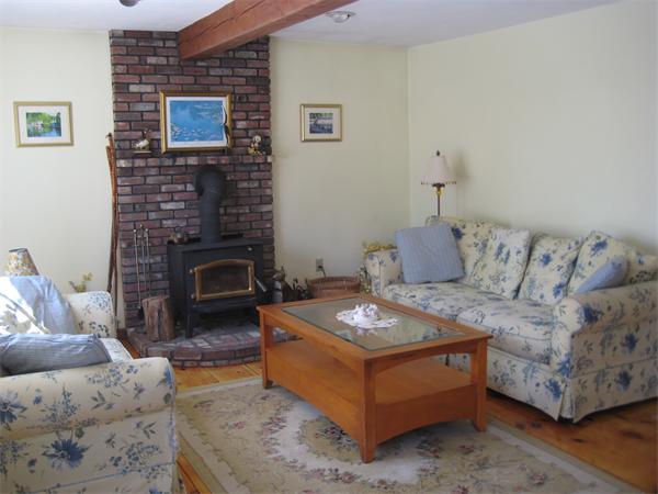 55 Boxford Road Ipswich, MA 01938 - Photo 3 of 21 a living room with furniture and a fireplace