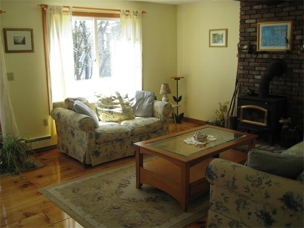 55 Boxford Road Ipswich, MA 01938 - Photo 4 of 21 a living room with furniture and a fireplace
