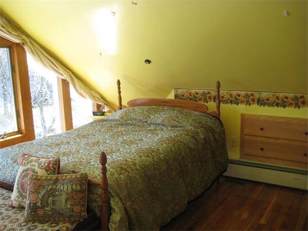 55 Boxford Road Ipswich, MA 01938 - Photo 9 of 21 a bed sitting in a bedroom next to a window