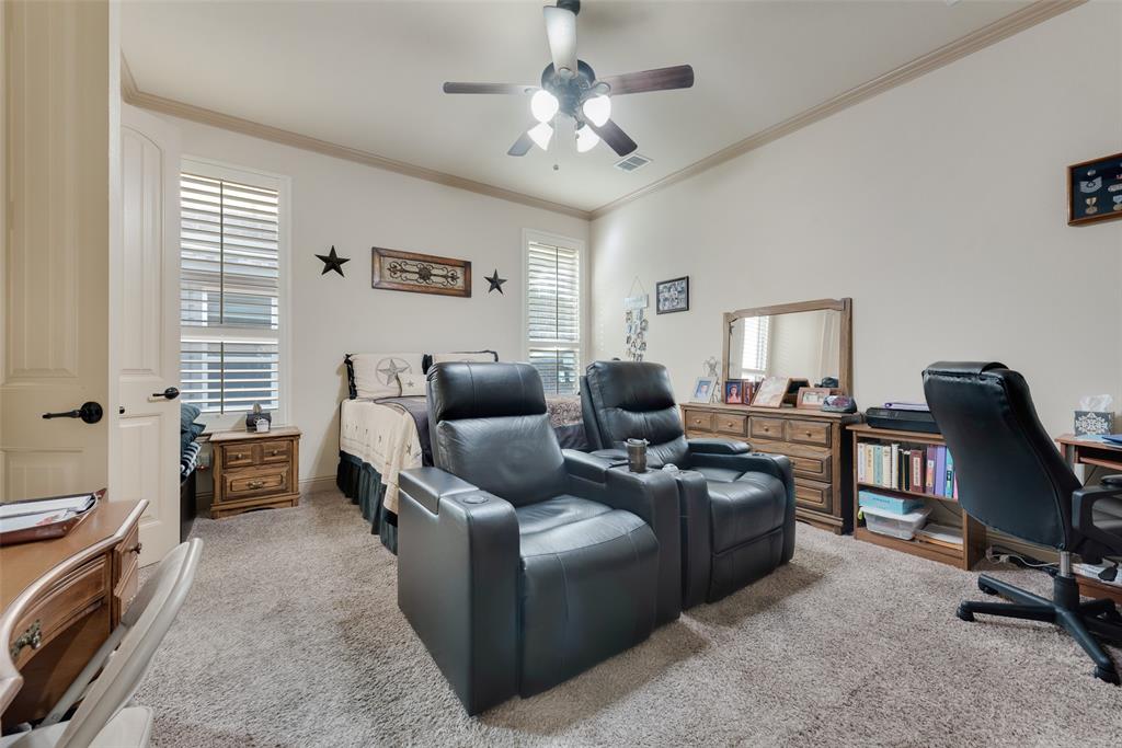 5056 Empire Way Irving, TX 75038 - Photo 13 of 39 Downstairs Primary Bedroom featuring ceiling fan and ornamental molding