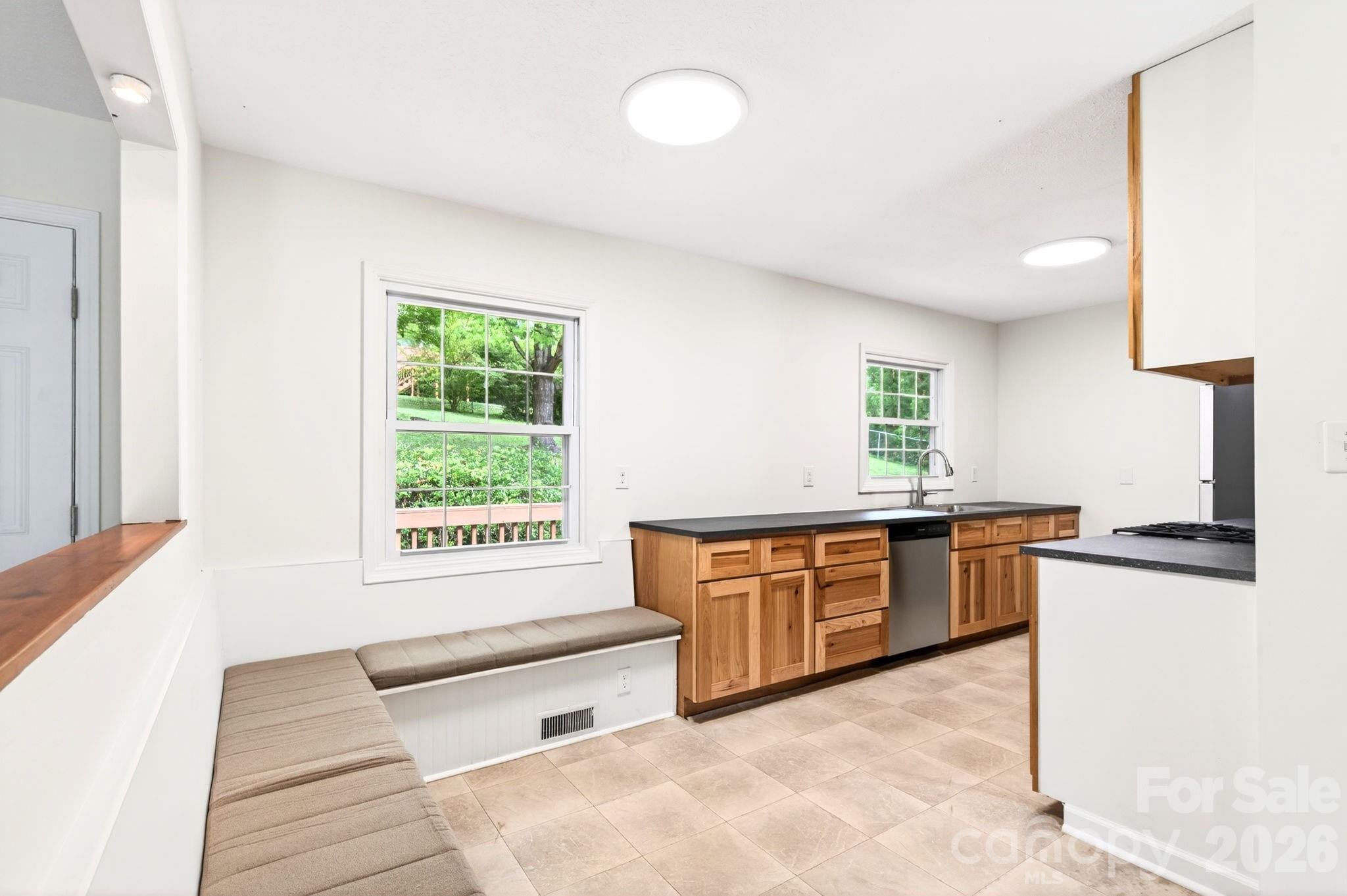34 Wolfe Cove Road Asheville, NC 28804 - Photo 20 of 42 a large kitchen with granite countertop a stove and a sink