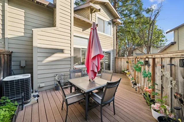 a view of a patio with a table and chairs