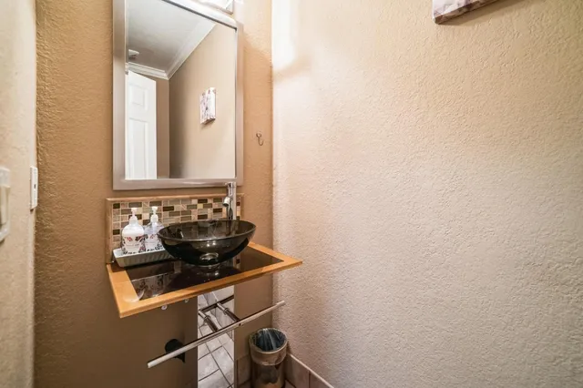 a bathroom with a sink and cabinets