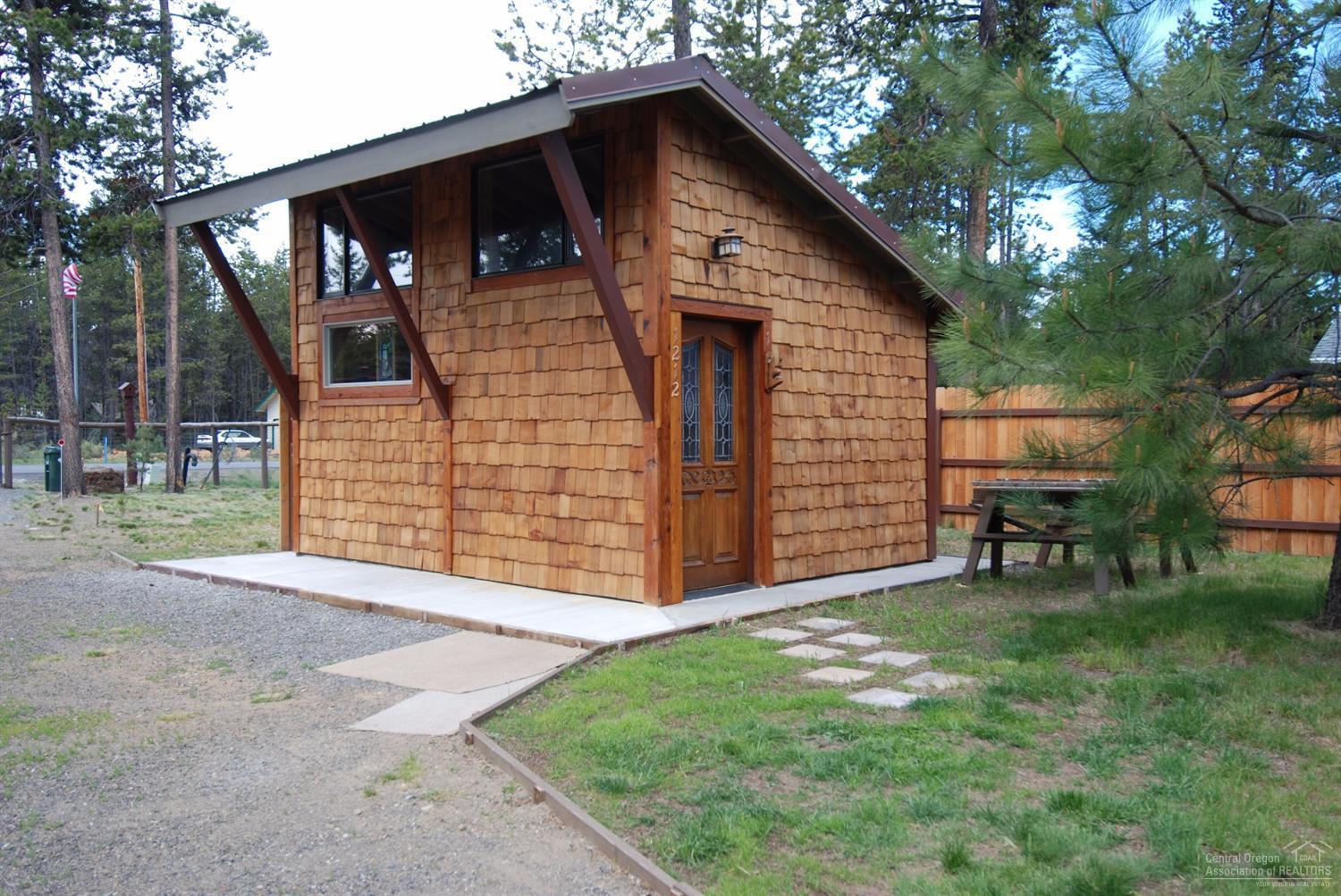 55726 Snow Goose Road Bend, OR 97707 - Photo 12 of 25 a front view of a house with garden