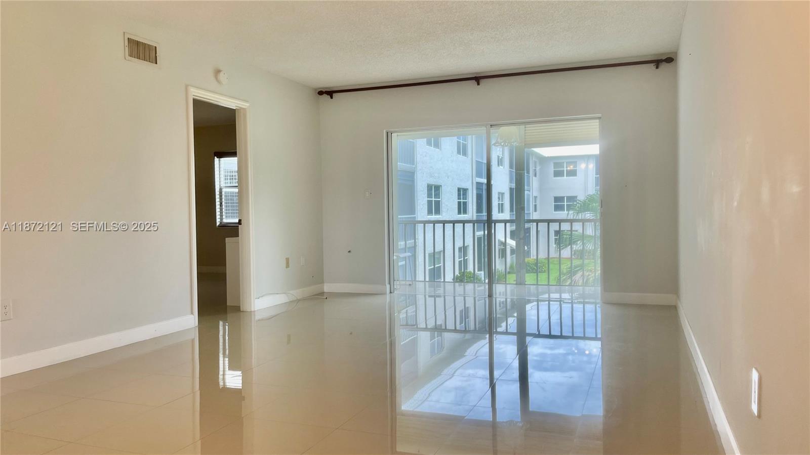 9856 Marina Boulevard, Unit 1320 Boca Raton, FL 33428 - Photo 15 of 48 a view of entryway with floor to ceiling window