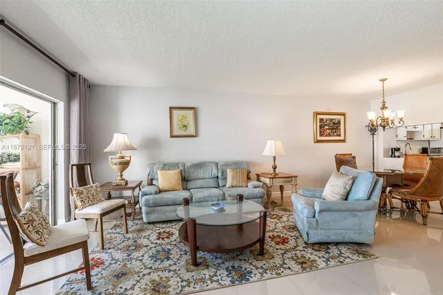a kitchen with stainless steel appliances granite countertop a stove microwave and cabinets