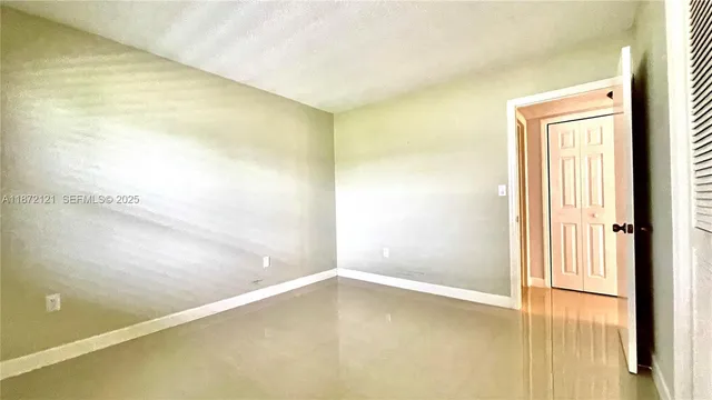 a view of a house with swimming pool and sitting area