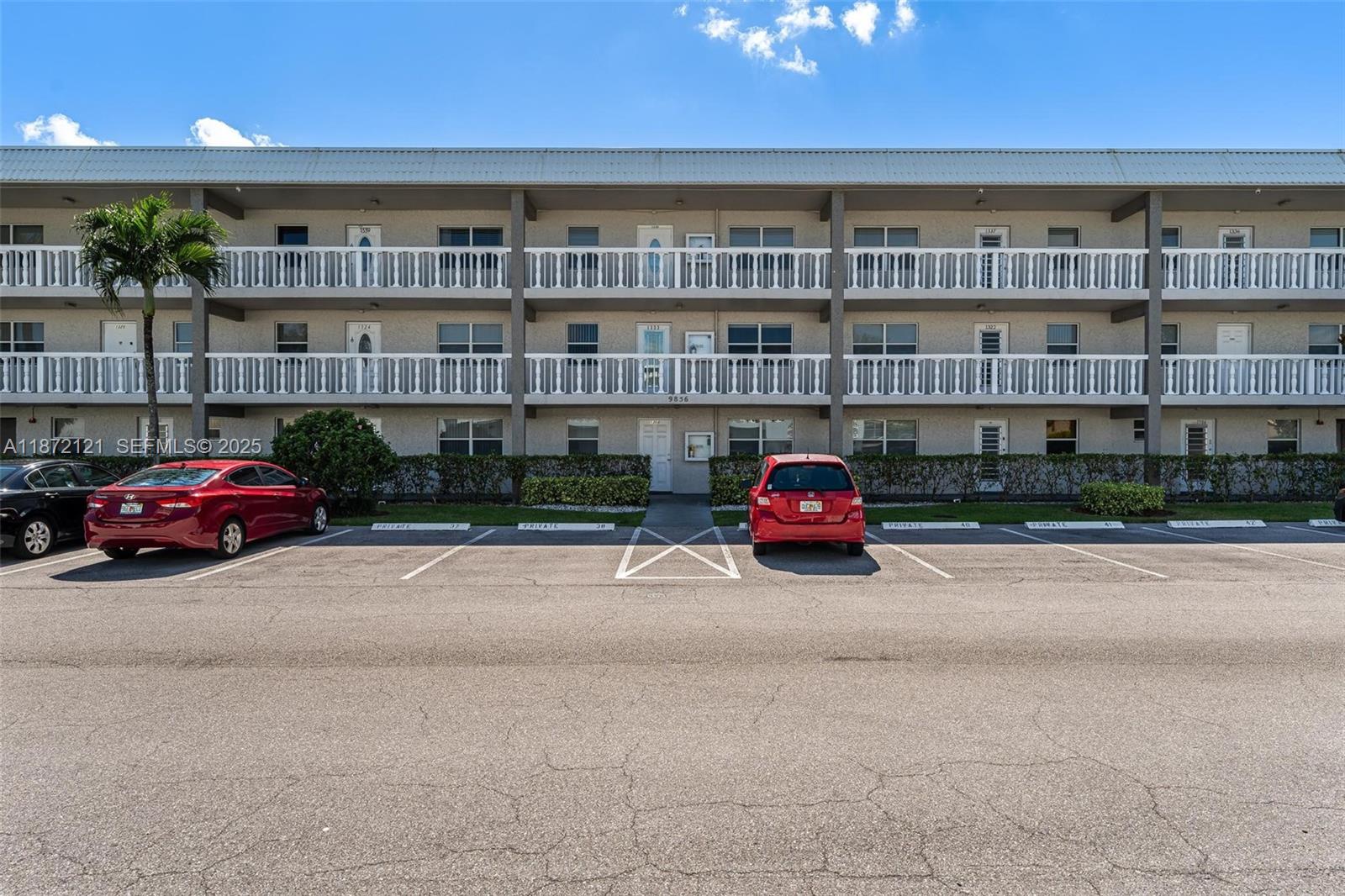 9856 Marina Boulevard, Unit 1320 Boca Raton, FL 33428 - Photo 41 of 48 a car parked in front of a building