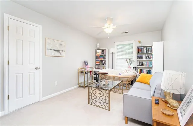 a living room with furniture and decor