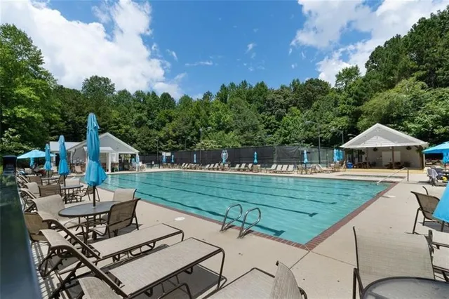 a view of a backyard with sitting area