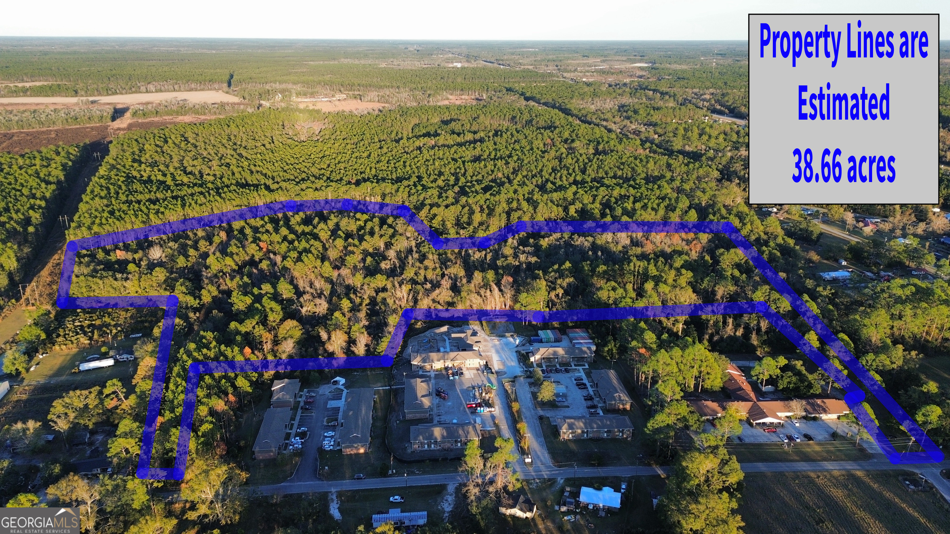 0 Northweat Street South Homerville, GA 31634 - Photo 1 of 1 a city street view with lots of flowers and trees